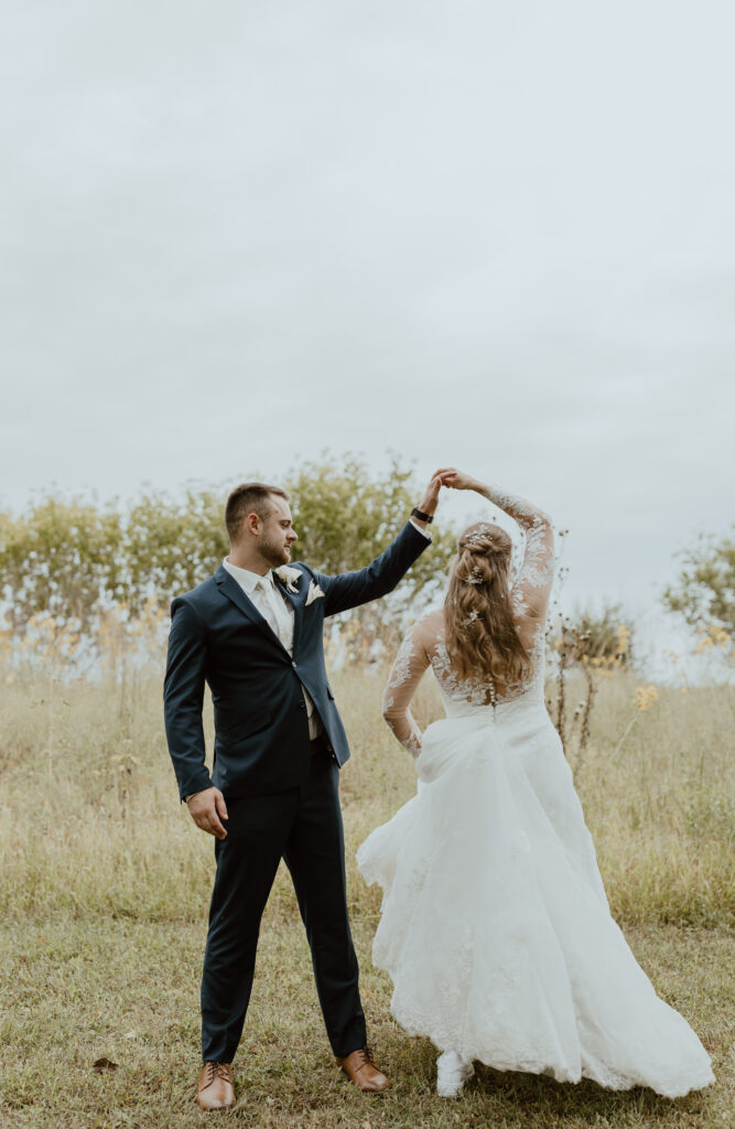 bride and groom dancing portraits after wedding ceremony