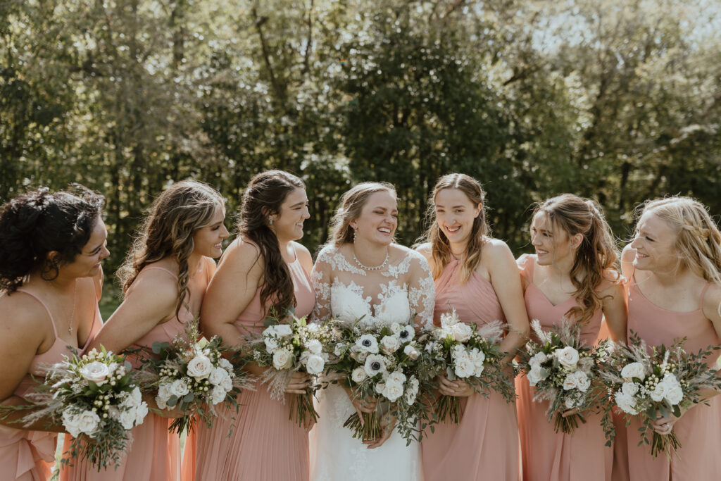 bridesmaids smiling on wedding day